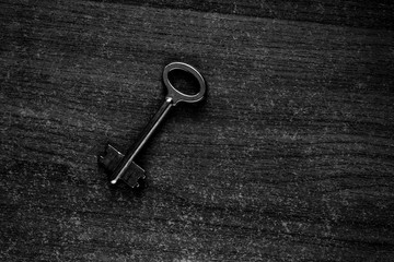 old key on a wooden surface