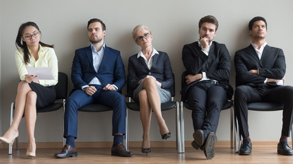 Diverse applicants waiting for their turn preparing for job interview