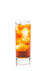 Cold cola beverage in glass with ice isolated on white background. Selective focus. Shallow depth of field.