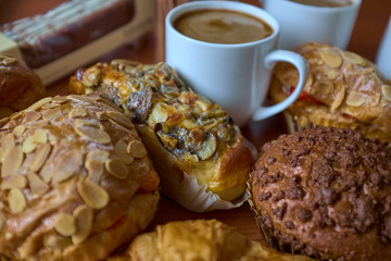 Nut Raisin Muffin, cakes, roll and caps of coffee