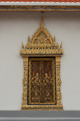 Fototapeta na wymiar Decorative gold Grand Palace window with shutters