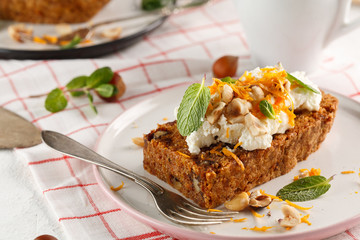 carrot fruit cake with nuts and cream