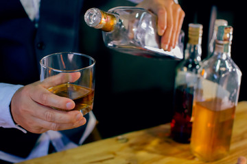 bartender pouring beer in glass