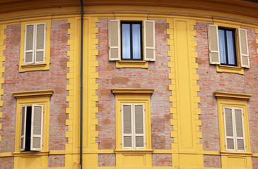 Fototapeta premium old yellow house windows and wall detail Rimini Italy