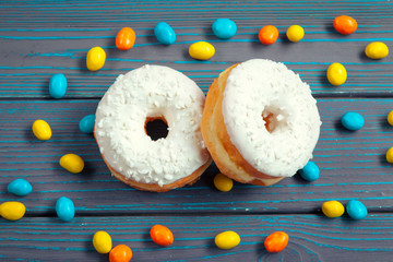Glazed donuts on wooden background