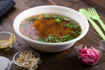 Vientamese traditional beef noodle soup pho bo with ingredients