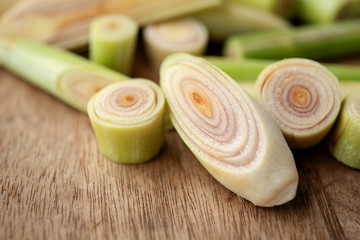 lemongrass slices on wood background.