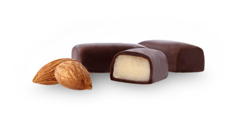Closeup shot of cut marzipan chocolate on white background. Marzipan candy.