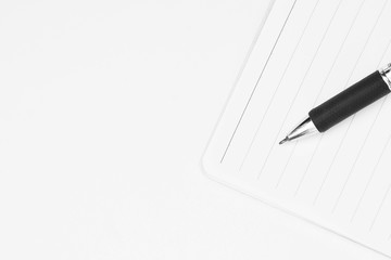 closeup pen on a diary - monochrome