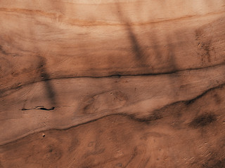 Wooden vintage red wood boards with rays of the evening sun