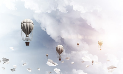 Flying hot air balloons in the air.