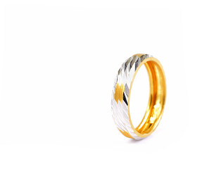 silver and gold ring isolated on white background