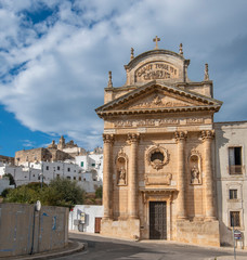 The picturesque old town and and Roman Catholic church Confraternity of Carmine. The white city in Apulia on the hill - Ostuni , Puglia, Italy