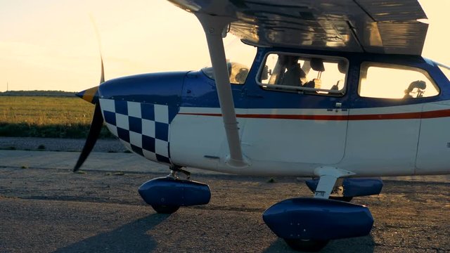 Airplane going on an airfield, side view.