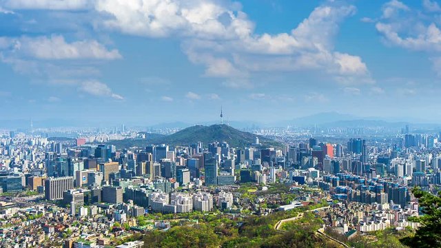 Time lapse of Cityscape in Seoul with Seoul tower and blue sky, South Korea.