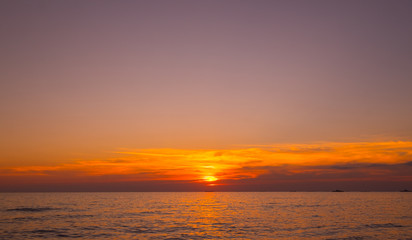 Vivid beautiful sunset and sunrise sky reflection on sea beach wave.