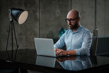 Middle-aged designer working in office