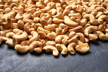 cashew nuts on black table , selective focus