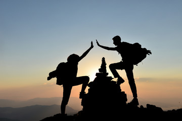 Fototapeta na wymiar climber reaching the peaks and the happiness of success