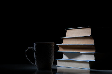 Book and cup with a tasty drink.