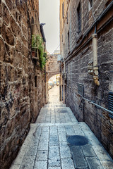 Narrow street in the old town, vertical
