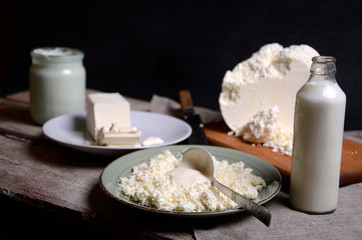 Butter, cottage cheese, and the jug of milk on the table