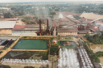 Industry factory manufacturing with pond of wastewater treatment