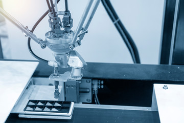 The robotic linkage-arm use in electronics production line with the lighting effect.The hi-technology electronic parts manufacturing process  in industrial 4.0 concept.