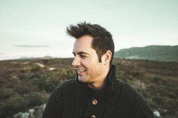 Portrait of a modern profile guy smiling outdoors. Photo style social networks and vintage