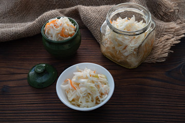 Homemade sauerkraut, pickled cabbage and carrots. Copy space.
