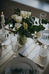 Beautiful festive table setting with elegant white flowers and cutlery, dinner table decoration 