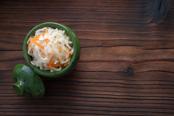 Fototapeta na wymiar Homemade sauerkraut, pickled cabbage and carrots. Copy space.