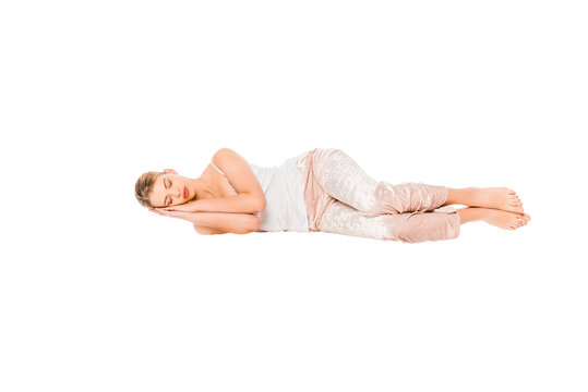 girl in pyjamas sleeping in air isolated on white