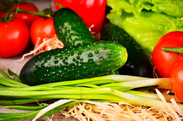 Some cucucmbers on vegetables