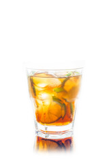 Cuba libre cocktail with cola and lime isolated on white background. Selective focus.