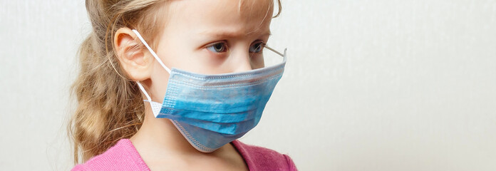Little girl doctor in mask