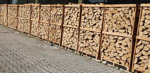 pallets with wood logs used for wood heating stoves