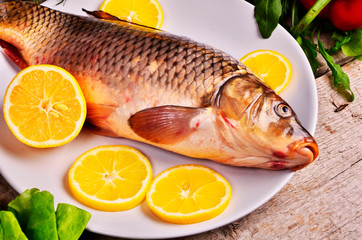 Fresh  fish and food ingredients on table