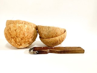 Coconut shell, light brown, stacked behind the grated coconut hand isolated on white background, Cocos nucifera L. crafts