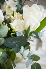 Obraz na płótnie Canvas Elegant bouquet of white freesias, tulips and hyacinth, beautiful bouquet of flowers