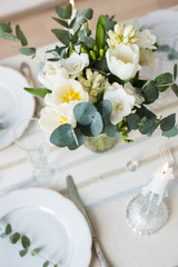 Beautiful festive table setting with elegant white flowers and cutlery, dinner table decoration 