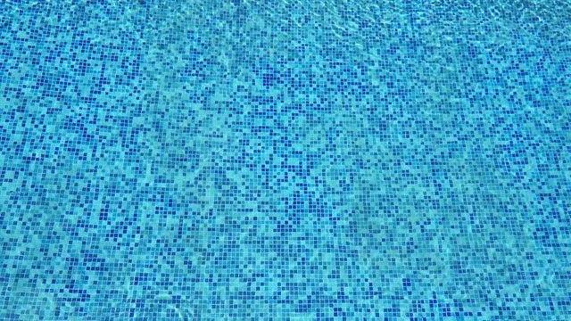Blue ripped water in swimming pool. Abstract background