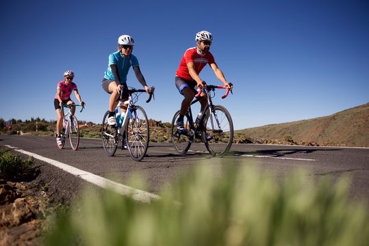 Group of road cyclists riding bikes