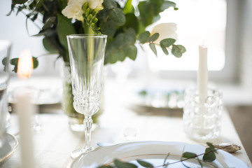 Beautiful festive table setting with elegant white flowers and cutlery, dinner table decoration 