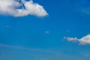 Blue sky with clouds. Beautiful calm sky with few clouds