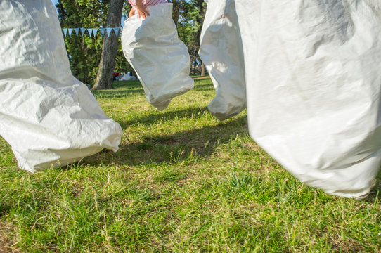 Children Having A Sack Race In The Park