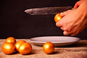 to smash the Golden egg on wooden background
