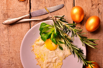 omelet of Golden eggs for Breakfast on wooden background