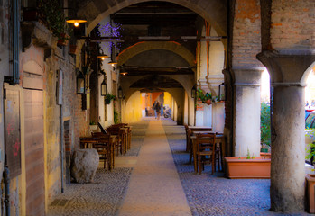 Fototapeta na wymiar Beautiful archs in the passage in Verona. Tourism, architecture, Europe, Italy - Image
