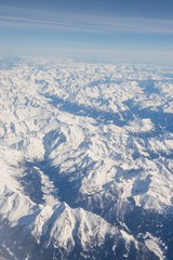 Aerial view of snow covered mountains - snowy mountain peaks - high mountains - Alps